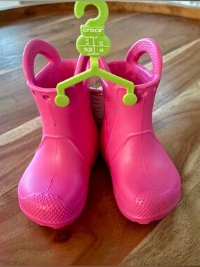 NWT Crocs “Handle it” Size Toddler 4 Pink Rain Boots with Easy Pull Handles.